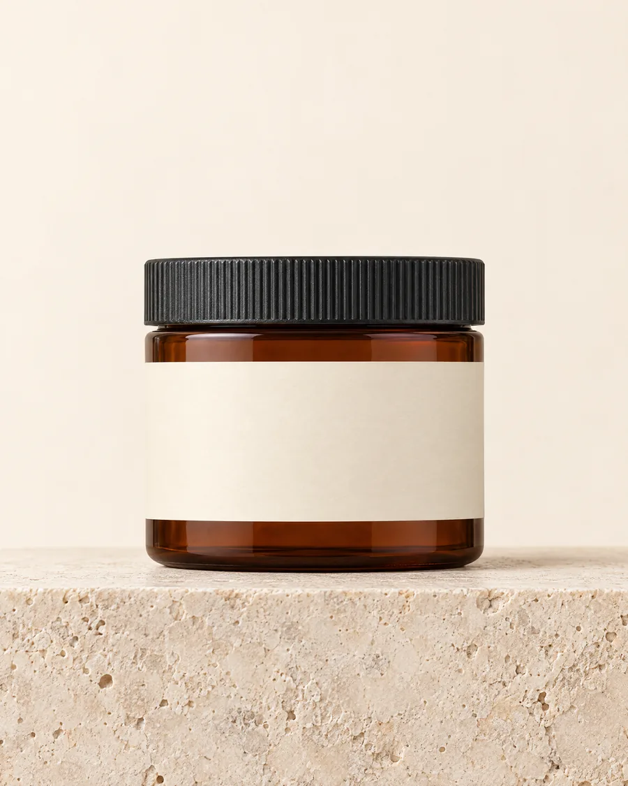 A 2 oz amber jar with a blank label